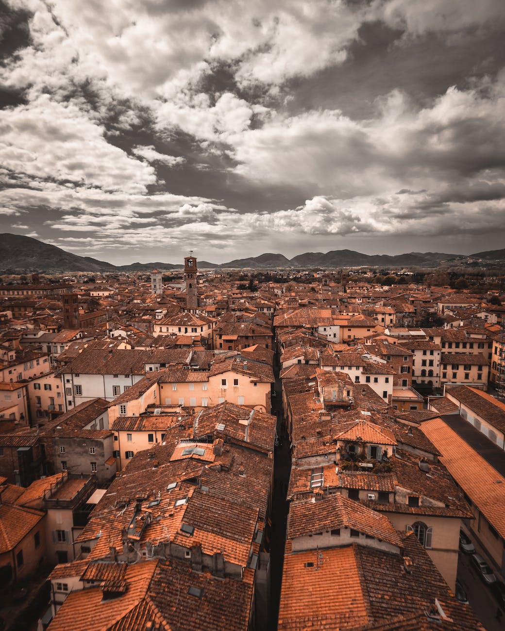 aerial view of buildings under cloudy sky